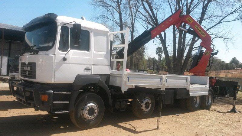 MAN F2000 with dropside and 45-ton palfinger crane