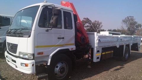 As good as new 2014 model Nissan ud100 dropside truck with fassi F110 crane